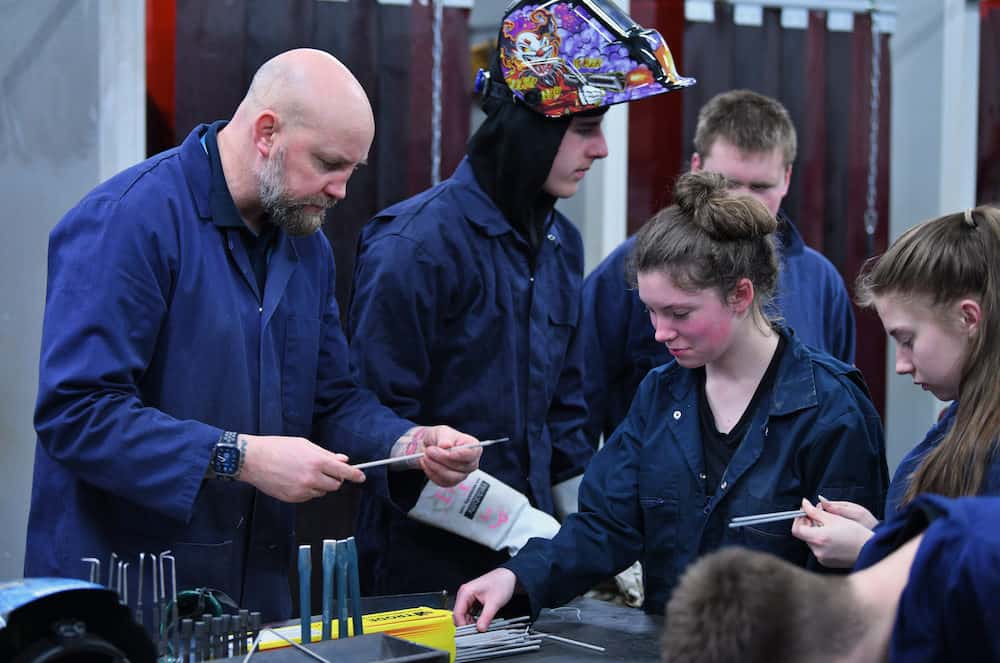 Lecturer demonstrating in engineering workshop
