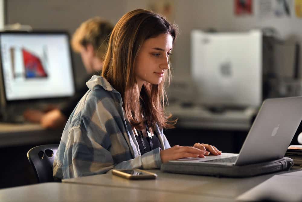 Games Design learner using a laptop