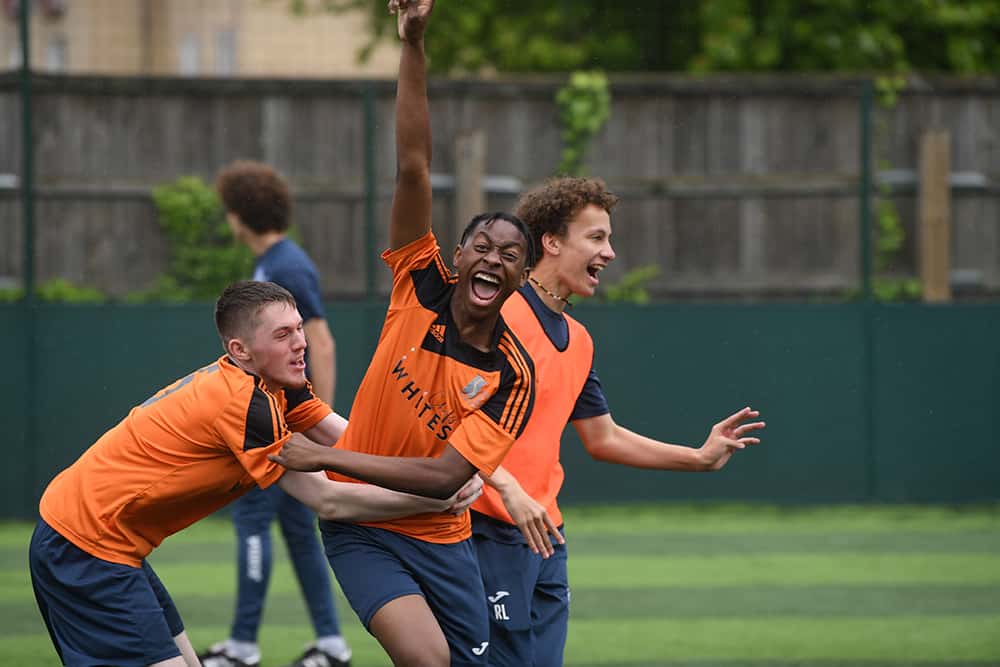 Learner celebrating football
