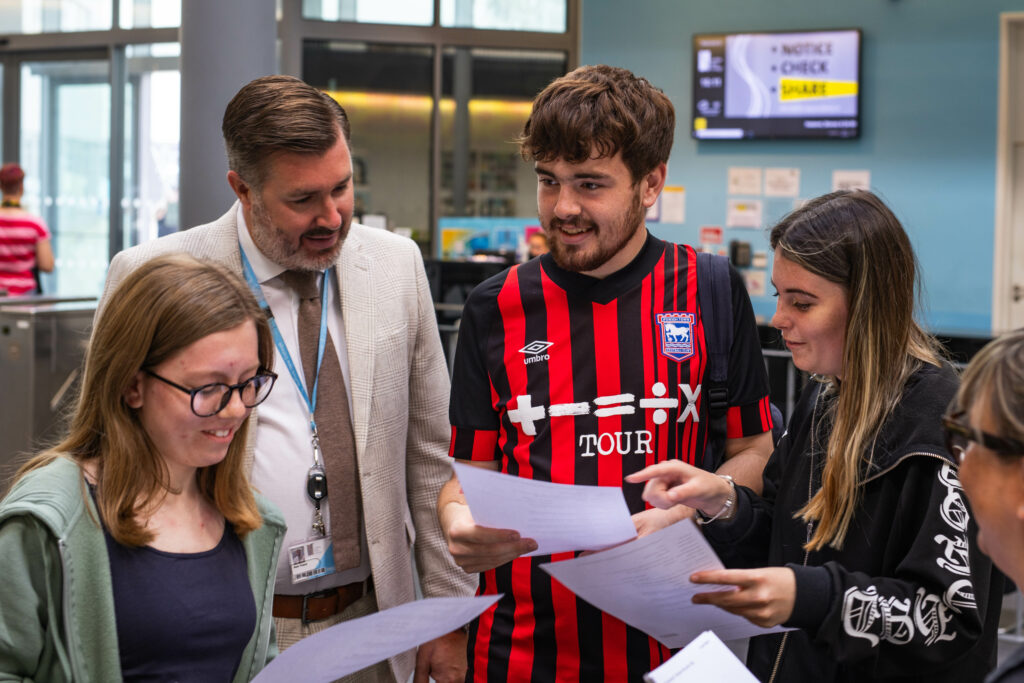 Principal Alan Pease with T level students opening their results