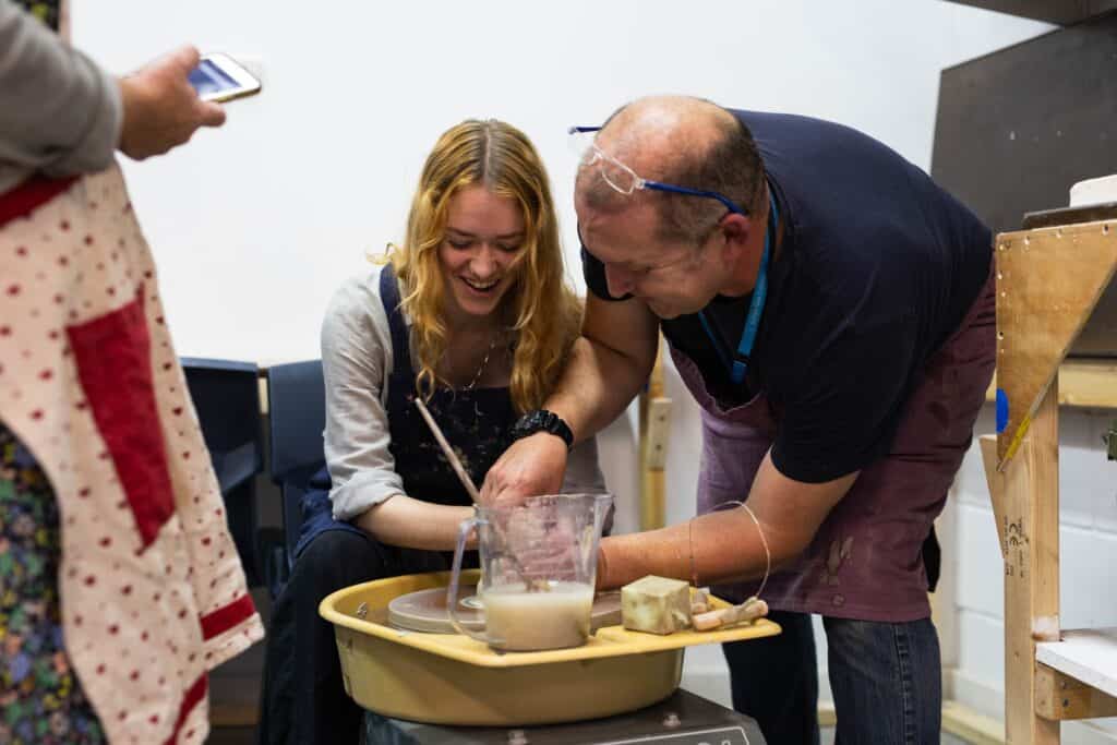 Learner Working With Tutor In a Leisure Learning Pottery Class
