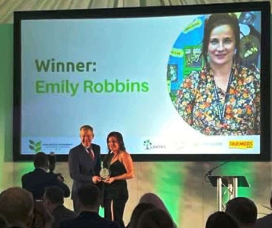 Emily Robbins receiving her award