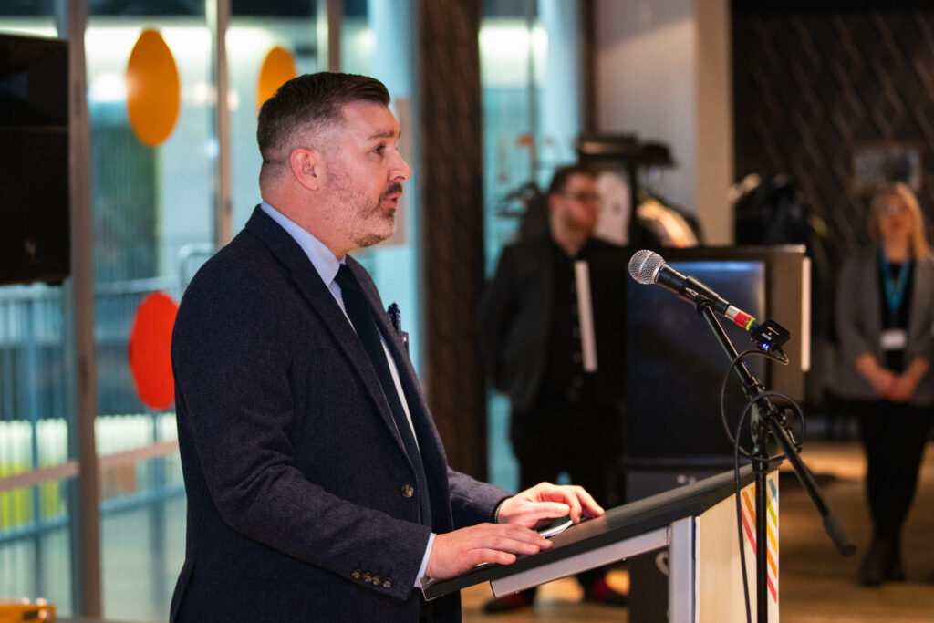 Alan Pease giving a speech