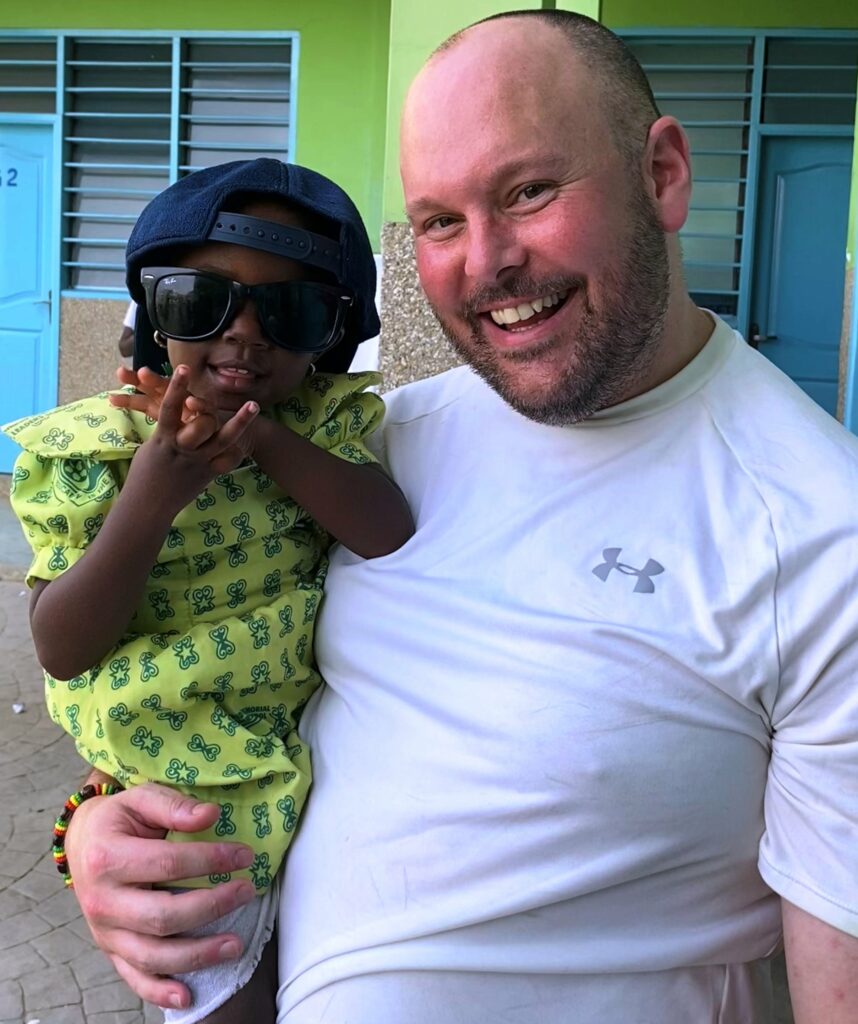 Lee Mandley with student from Ghana