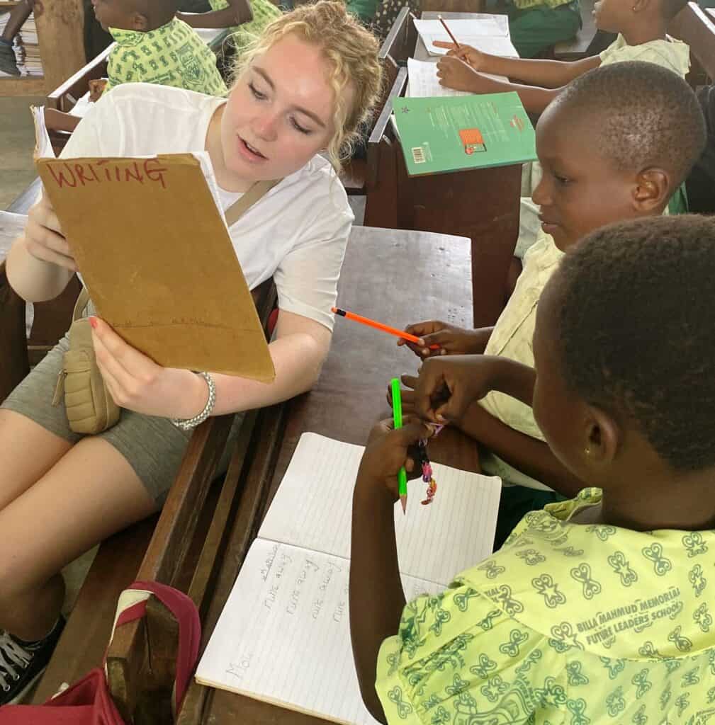 Suffolk New College learner helping in the classroom