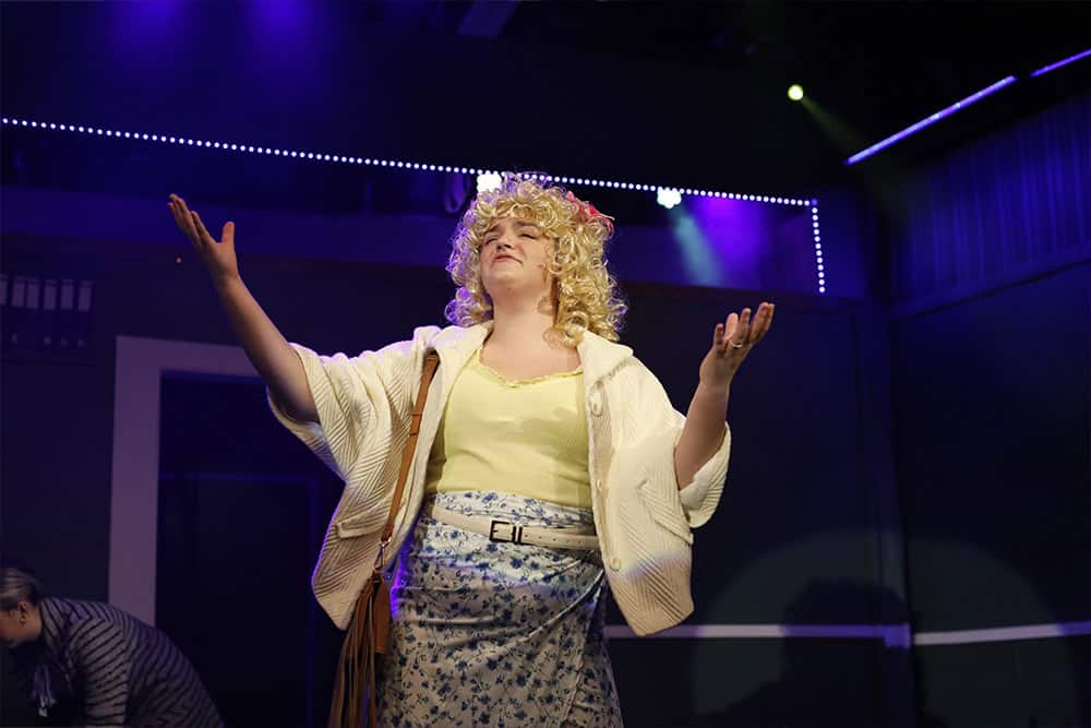 Kaytlin Hammett playing Doralee Rhodes