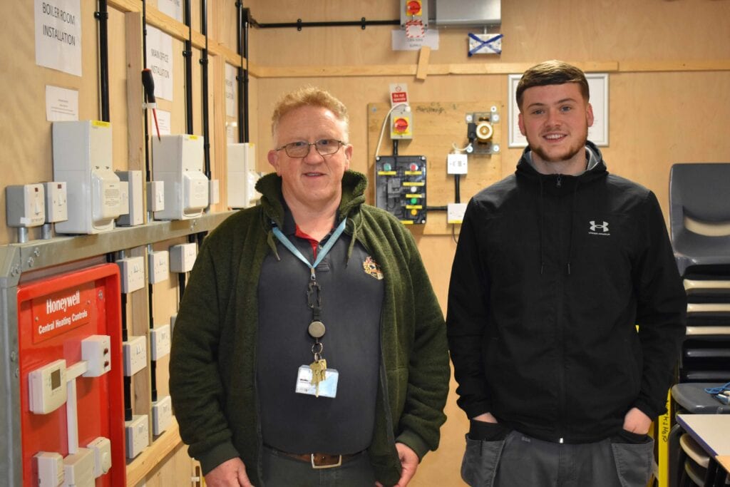 Tutor and learner in the electrical workshop