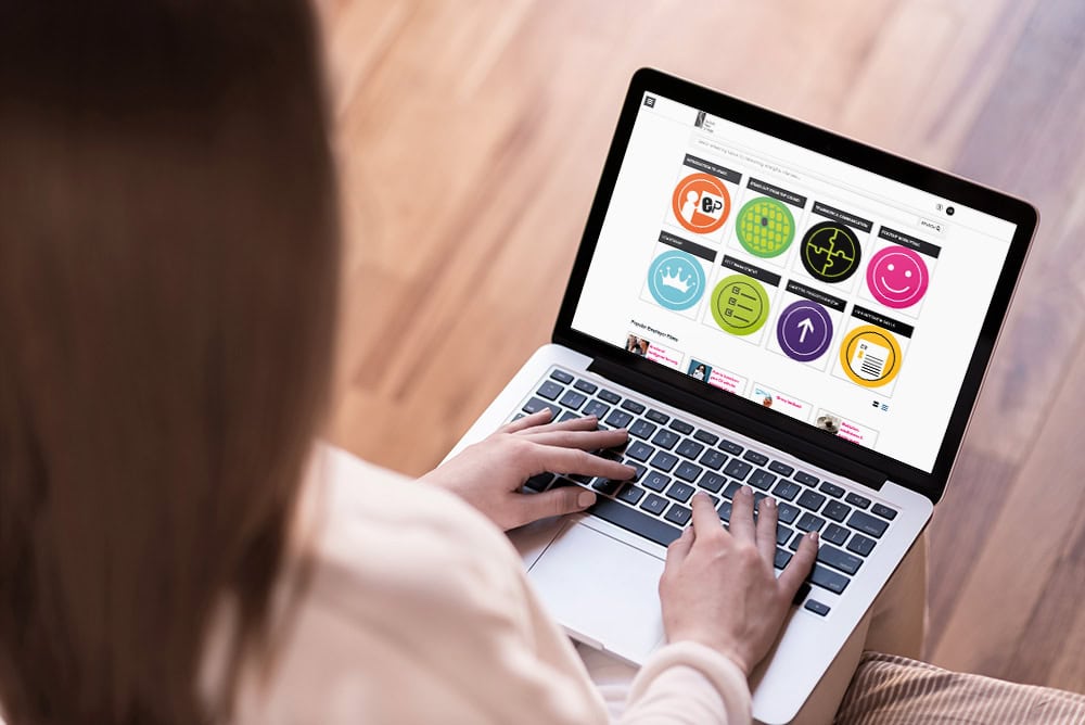 A Person Using A Laptop To View Epass Modules