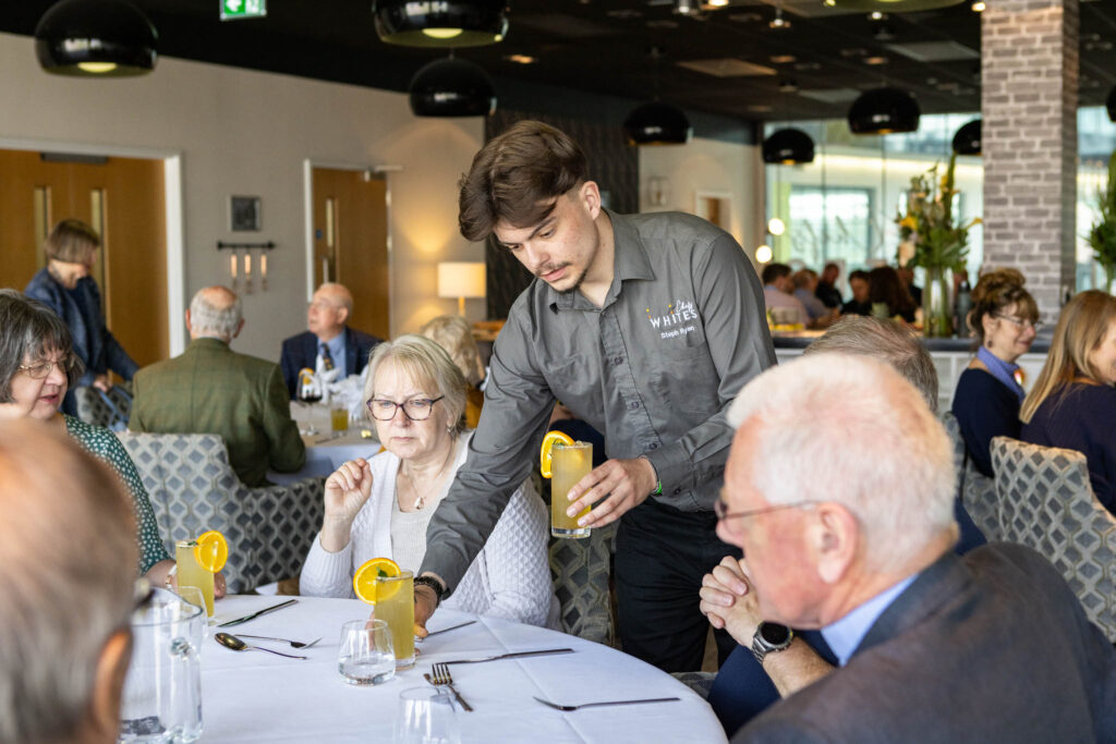 Staff serving in restaurant