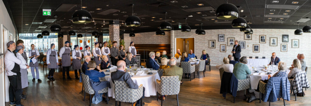 Awards presentation in chefs whites restaurant